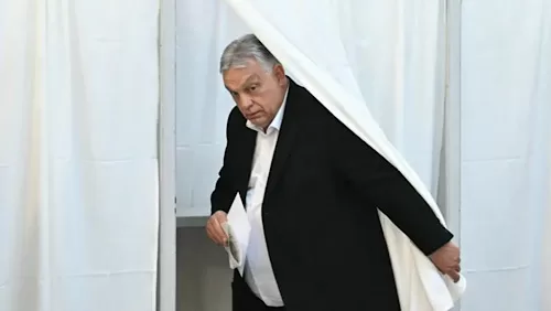 Orbán faces survival test as Hungary votes 11 - Egyptian Gazette Hungary's nationalist Prime Minister Viktor Orban of the Fidesz party leaves the voting booth as he prepares to cast his ballot at a polling station in Budapest during a general election in Hungary, on April 12, 2026. (AFP)