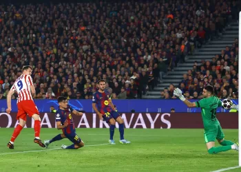Atletico stuns 10-man Barca at Camp Nou