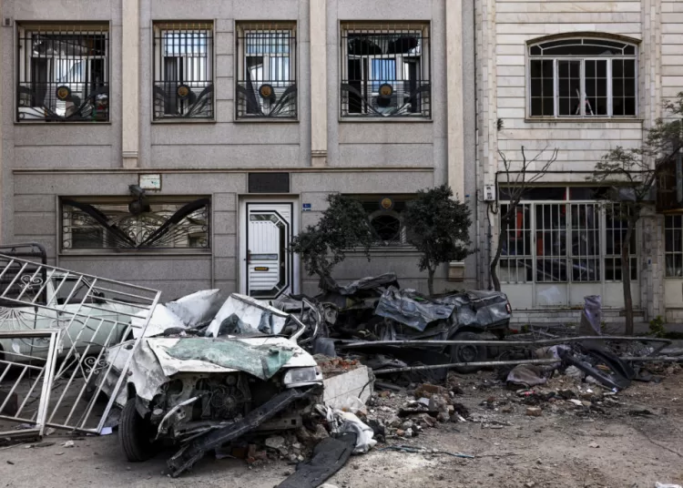Car wrecks and a residential building damaged by a strike amid the U.S.-Israeli conflict with Iran, in Tehran, Iran, March 30, 2026. Majid Asgaripour/WANA (West Asia News Agency) via REUTERS ATTENTION EDITORS - THIS PICTURE WAS PROVIDED BY A THIRD PARTY