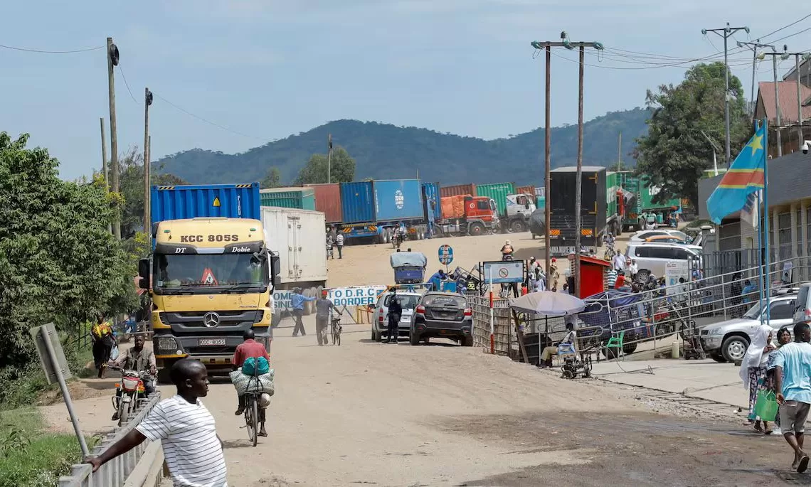 People walk , after Uganda closed its borders with the Democratic Republic of Congo, as authorities intensify efforts to contain a new Ebola outbreak caused by the Bundibugyo virus strain, at the Mpondwe border post, in Kasese district, Uganda, May 28, 2026. REUTERS/