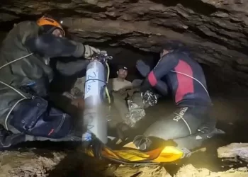 Rescuers pull four from flooded cave in Laos, two still missing