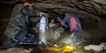 Rescuers pull four from flooded cave in Laos, two still missing