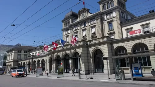 Man stabs 3 in Swiss train station 11 - Egyptian Gazette Commuters walk past a police vehicle parked in front of the central train station where a man wounded three people with a bladed weapon in Winterthur, near Zurich on May 29, 2026. (AFP)