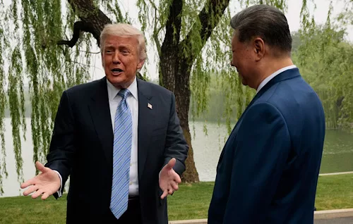 Trump, Xi end summit touting progress but key differences remain 12 - Egyptian Gazette U.S. President Donald Trump, left, speaks as he is greeted by Chinese President Xi Jinping at Zhongnanhai Garden in Beijing, China, Friday, May 15, 2026. (Evan Vucci/Pool Photo via AP)