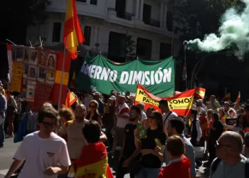 Tens of thousands march in Madrid to demand PM’s resignation