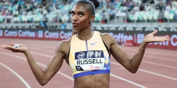 Russell threatens 100m hurdles record