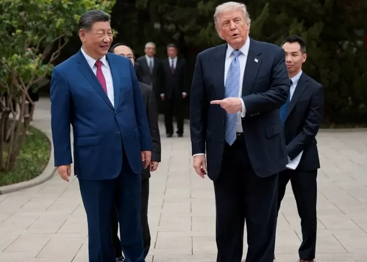 US President Donald Trump gestures towards Chinese President Xi Jinping while leaving after a visit to the Zhongnanhai Garden in Beijing, China, May 15, 2026. (Reuters)