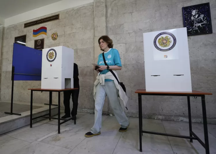 People visit a polling station during a parliamentary election in Yerevan, Armenia, June 7, 2026. Vahram Baghdasaryan/Photolure via REUTERS