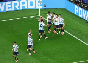 Milestone Messi sends Argentina to World Cup knockout stage