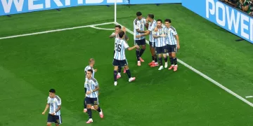 Milestone Messi sends Argentina to World Cup knockout stage