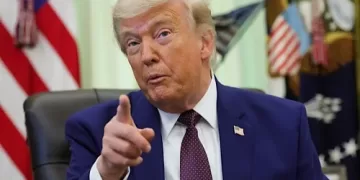 Iran threatens response after Beirut strike; Trump urges restraint