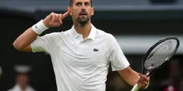 Djokovic survives Wimbledon opener