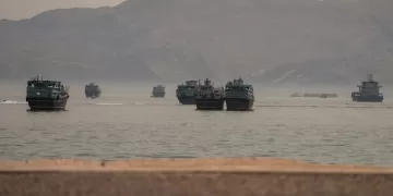 Tanker struck in Hormuz as Iran, US trade attacks in worst escalation
