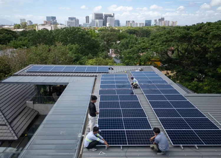 Iran war pushes Asia to diversify energy 11 - Egyptian Gazette A team of solar installers set up a new rooftop solar system at a home in Manila, Philippines, on May 1, 2026.