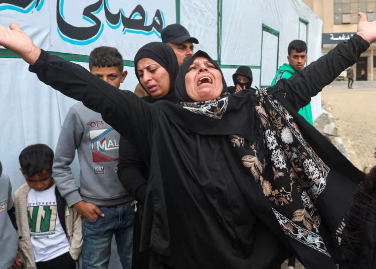 Israeli strike kills two people in Gaza 12 - Egyptian Gazette A woman mourns during the funeral of six Palestinians, including three policemen, killed in Israeli strikes, according to medics, at Nasser Hospital in Khan Younis in the southern Gaza Strip, March 29, 2026. REUTERS/Ramadan Abed