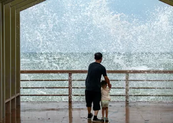 Tropical storm hits China’s Hainan, halting travel