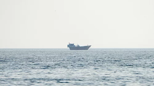 US issues new Iran sanctions on oil tankers 11 - Egyptian Gazette A vessel at the Strait of Hormuz, as seen from Musandam, Oman, July 23, 2026. REUTERS