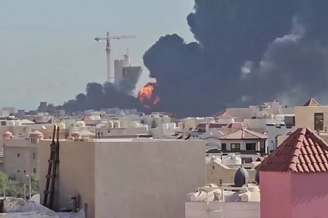 Kuwait responds to Iranian missile, drone attacks 12 - Egyptian Gazette This screen grab taken from UGC video footage posted on social media on July 18, 2026, shows a plume of black smoke and flames billowing over the town of Mangaf, south of Kuwait City.