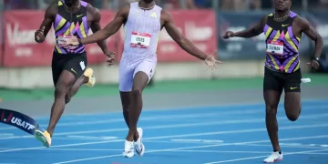 Lyles sprints to US 100m gold