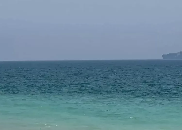 Drone hits tanker in Strait of Hormuz, UKMTO says 10 - Egyptian Gazette This frame grab taken from AFPTV video footage on July 12, 2026 shows cargo ships anchoring near the Strait of Hormuz off the eastern coast of the United Arab Emirates at Khor Fakkan. (File photo)