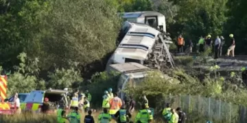 Passenger train derails, flips in southern England
