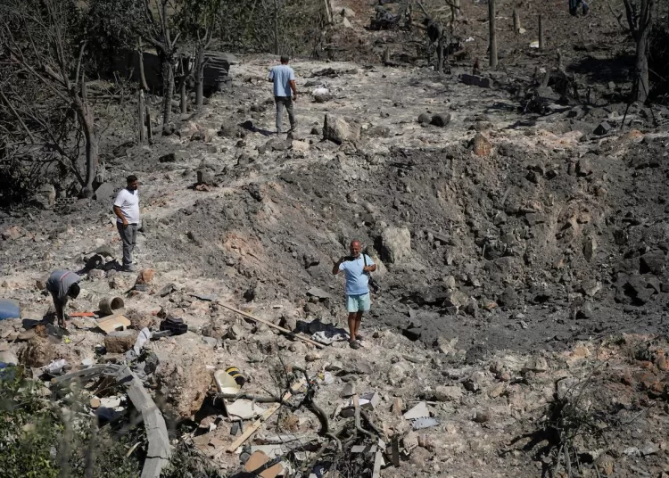 Israel links Lebanon withdrawal to Hezbollah disarmament 10 - Egyptian Gazette People and journalists stand at a site hit by Israeli strikes that occurred in the early hours of Thursday, according to Lebanon’s state news agency NNA, in Burj al-Shamali, southern Lebanon, August 6, 2026. REUTERS/