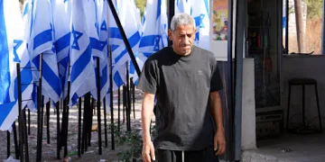 Settlers flank Palestinian cafe with Israeli flags