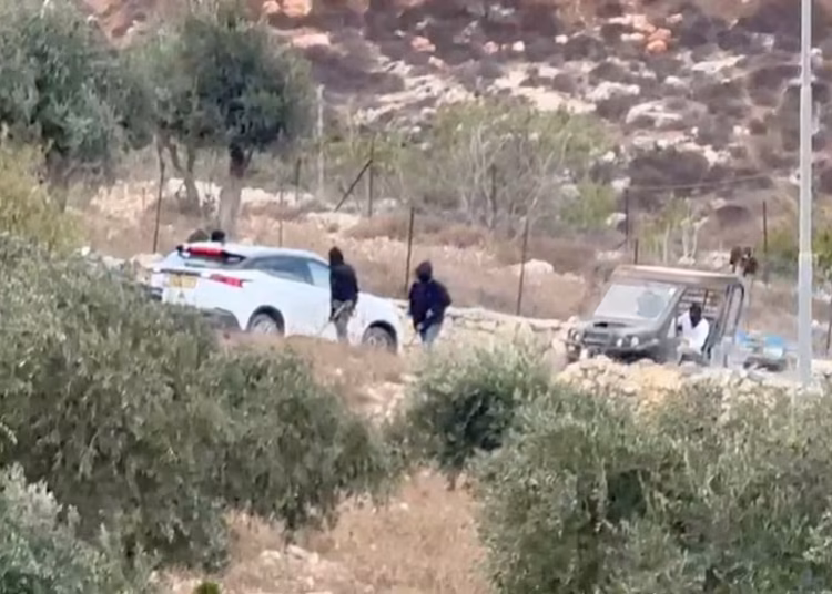 Vehicles at the site where Belgium's foreign minister says masked settlers in the Israeli-occupied West Bank attacked Palestinians, Catholic representatives and Western diplomats and officials, in Taybeh, in the Israeli-occupied West Bank, October 17, 2026 in this screengrab from a video obtained from social media. Emad Diab/via REUTERS