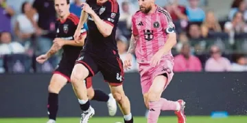 Messi scores twice in 1st game after Argentina exit