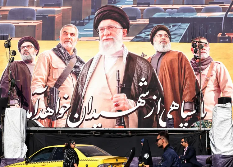 Commuters ride past a large billboard depicting slain Supreme Leader Ayatollah Ali Khamenei in Tehran this week. Photo: Atta Kenare/AFP via Getty Images